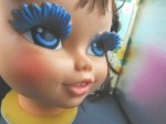 doll head blue lashes face